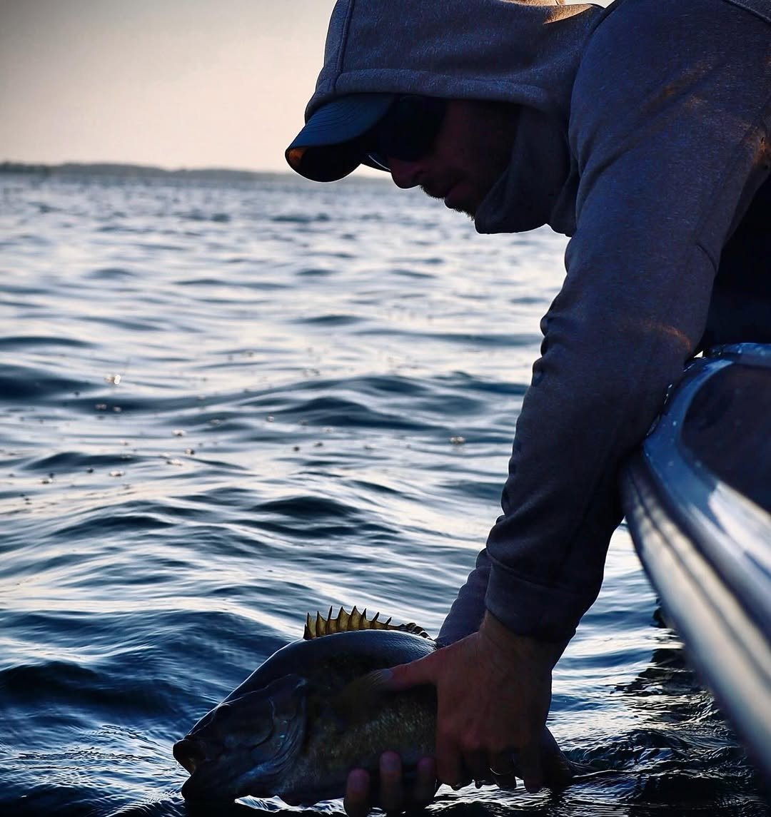 Releasing a trophy smallmouth on the St. Lawrence River