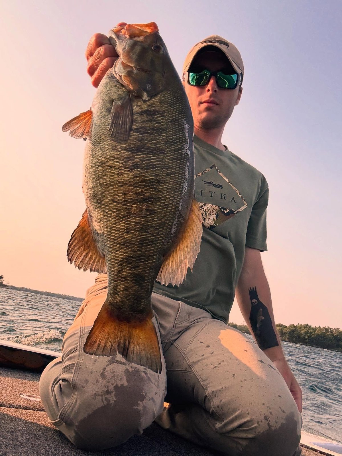 Trophy smallmouth bass at sunset on the St. Lawrence River